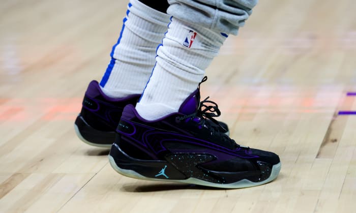 View of Luka Doncic's black and purple Jordan Brand shoes.